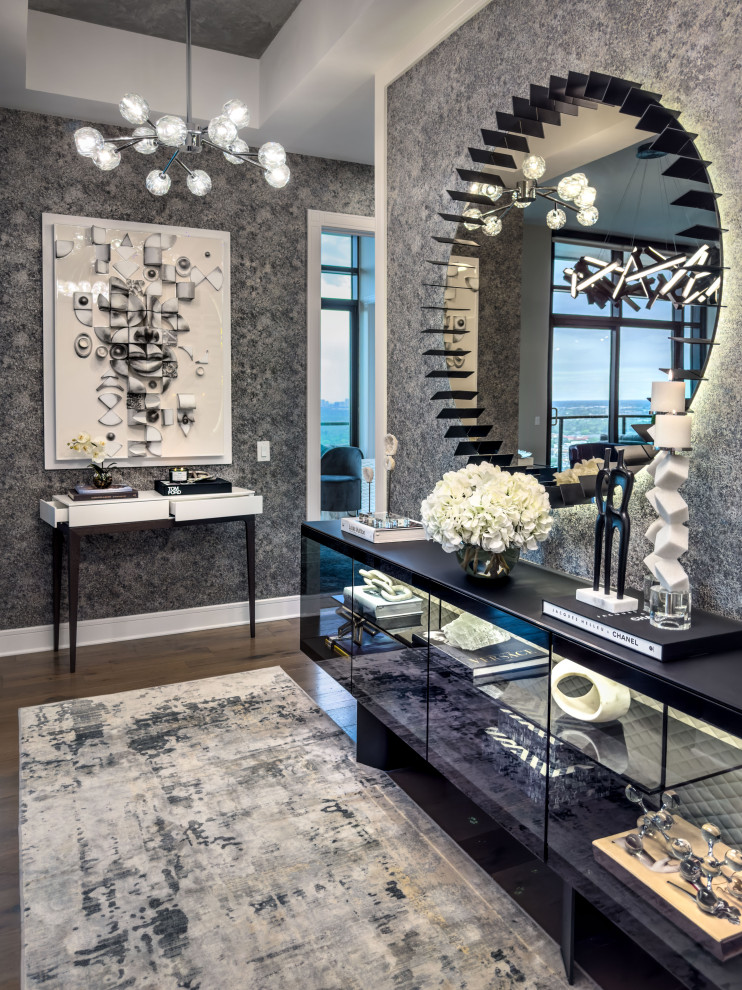 Foyer - mid-sized contemporary dark wood floor, brown floor and wallpaper foyer idea in Houston with gray walls
