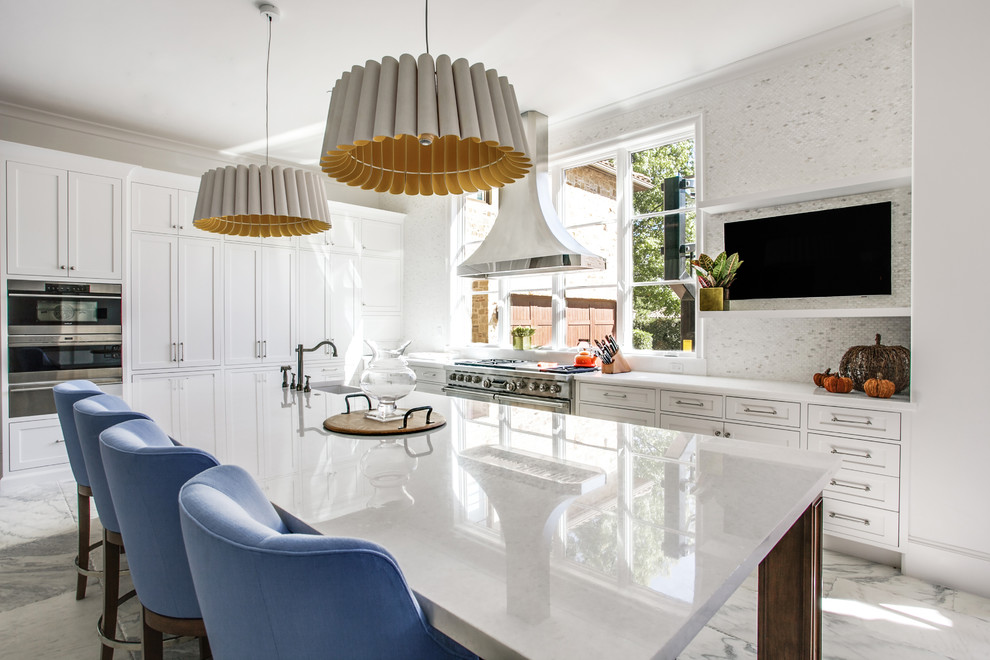 Example of a huge transitional single-wall marble floor open concept kitchen design in Dallas with a farmhouse sink, shaker cabinets, white cabinets, marble countertops, white backsplash, mosaic tile backsplash, stainless steel appliances and an island