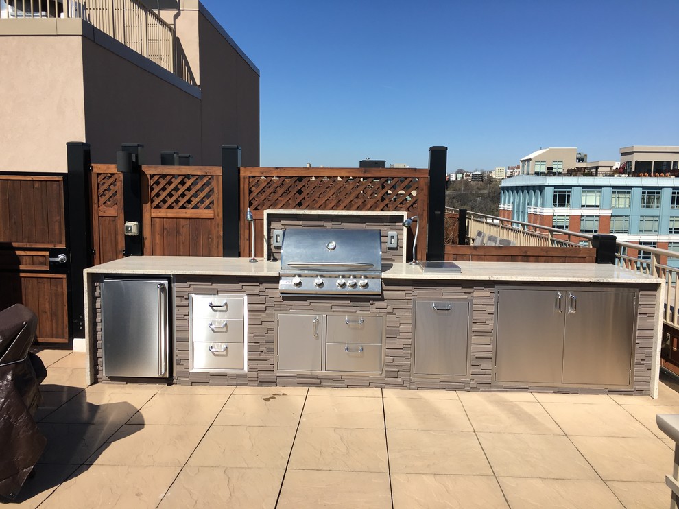 Inspiration for a mid-sized modern rooftop deck in New York with an outdoor kitchen and no cover.