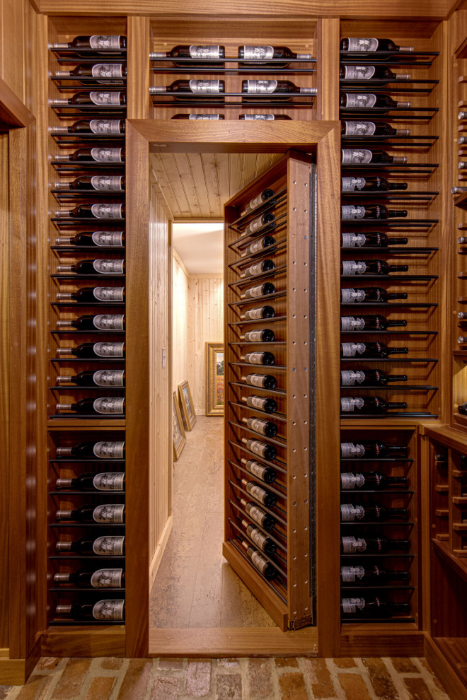 Secret passageway wine cellar. Basement layout with all mahogany racking.