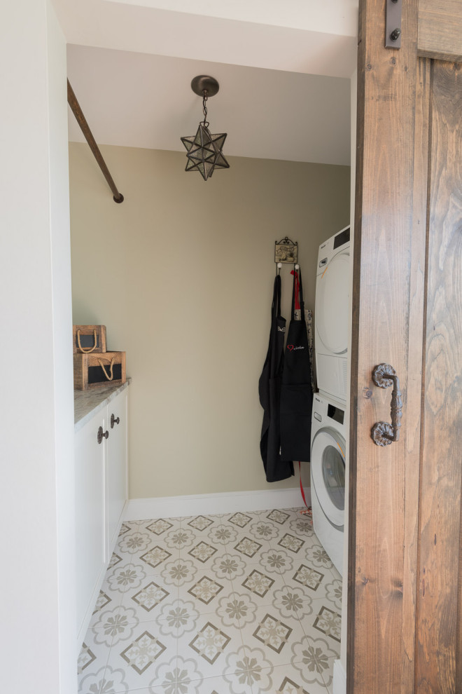 Inspiration for a mid-sized transitional u-shaped light wood floor and brown floor eat-in kitchen remodel in Boston with an undermount sink, shaker cabinets, white cabinets, granite countertops, brown backsplash, glass tile backsplash, stainless steel appliances, an island and multicolored countertops