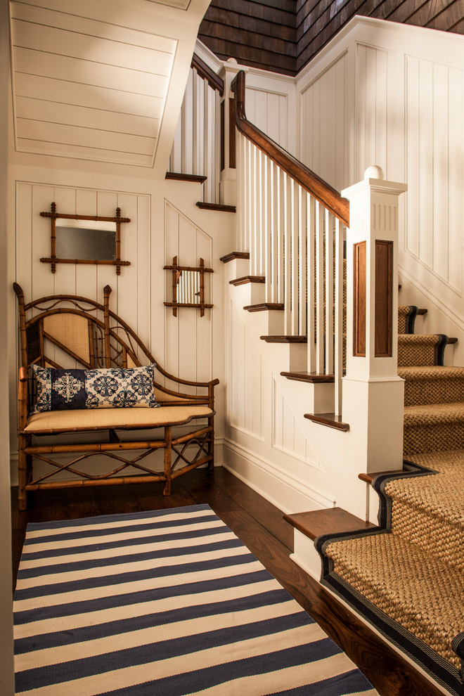 Mid-sized tropical wood l-shaped staircase in Charleston with wood risers.