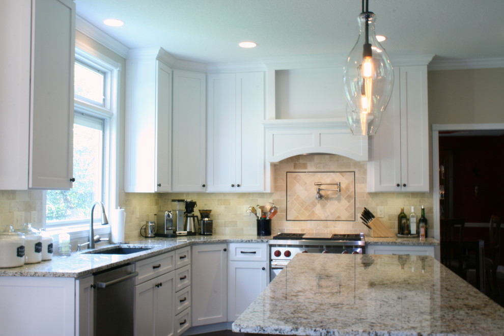 Eat-in kitchen - transitional eat-in kitchen idea with white cabinets, stainless steel appliances and an island