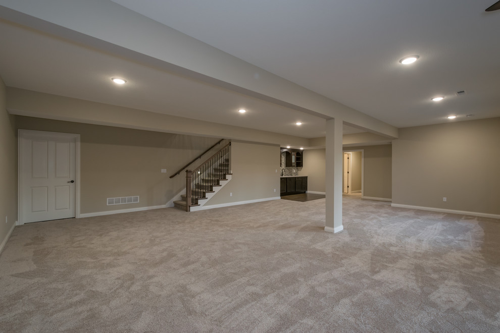 Home design - huge rustic walk-out carpeted and gray floor home design idea with beige walls