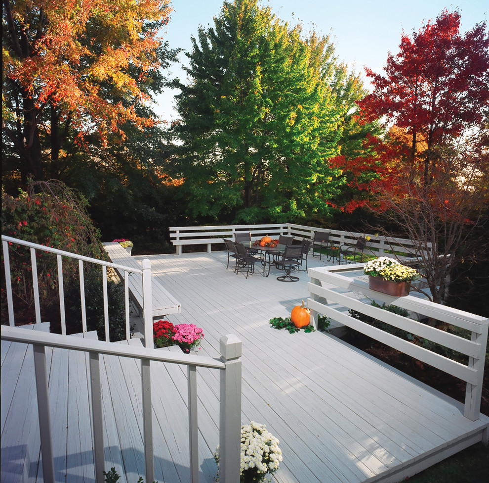 Traditional backyard deck in Other.