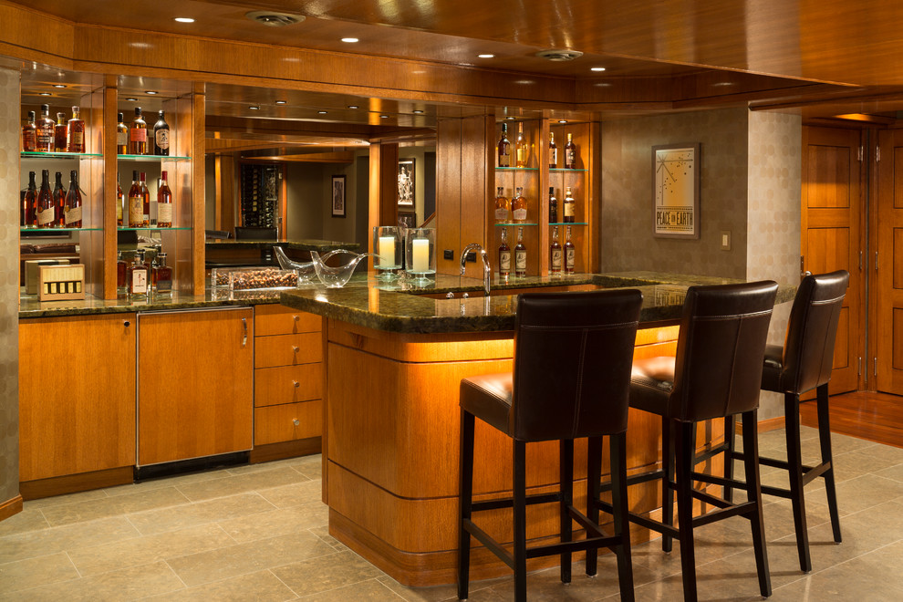 This is an example of a traditional u-shaped seated home bar in Denver with open cabinets, medium wood cabinets, mirror splashback and beige floor.