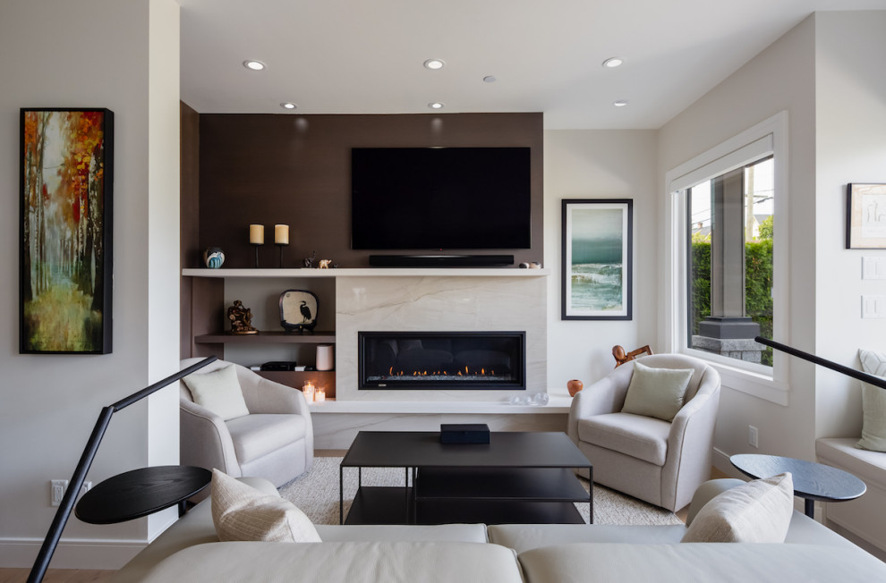 Inspiration for a small open plan living room in Vancouver with white walls, medium hardwood flooring, a ribbon fireplace, a stone fireplace surround, a wall mounted tv and brown floors.