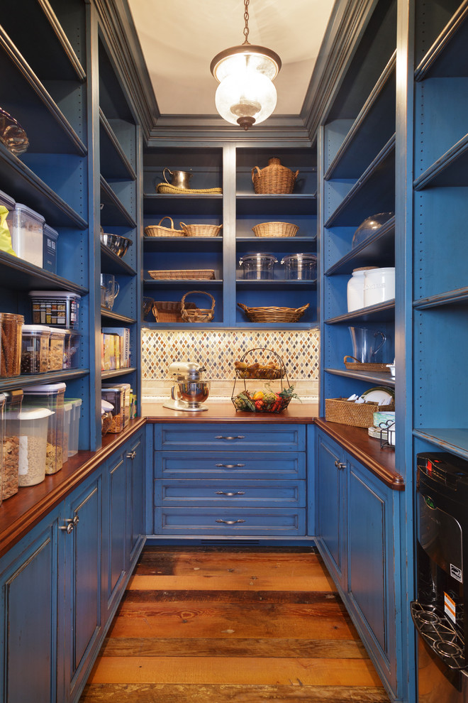 Traditional u-shaped kitchen pantry in Other with open cabinets, blue cabinets, wood benchtops, multi-coloured splashback, mosaic tile splashback and medium hardwood floors.