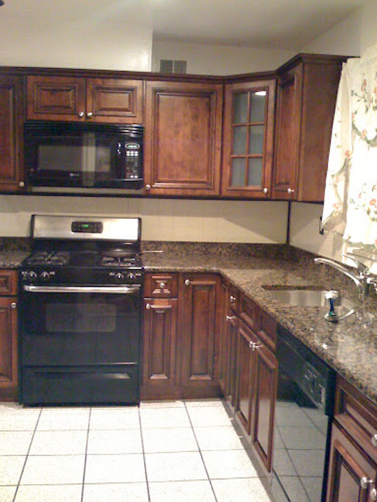 Example of a transitional kitchen design in DC Metro with beaded inset cabinets, dark wood cabinets and granite countertops
