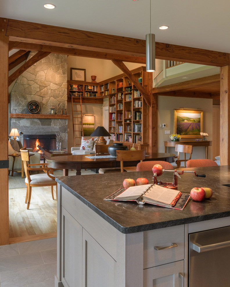 Example of a gray floor kitchen design with an undermount sink and shaker cabinets