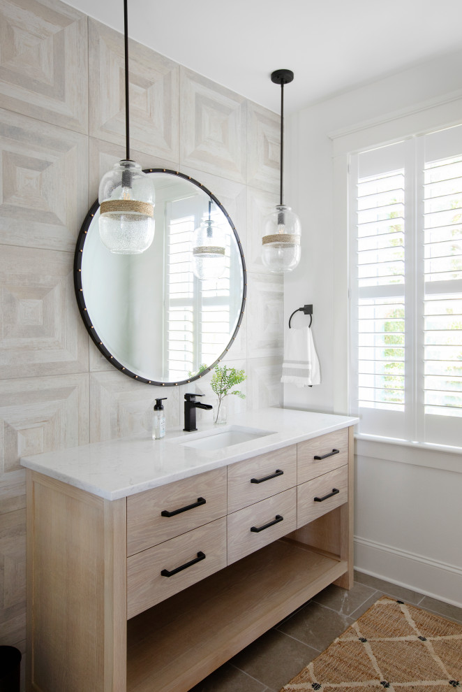 This is an example of a beach style bathroom in Charleston with light wood cabinets, multi-coloured tile, white walls, an undermount sink, engineered quartz benchtops, white benchtops, a single vanity, a freestanding vanity and flat-panel cabinets.