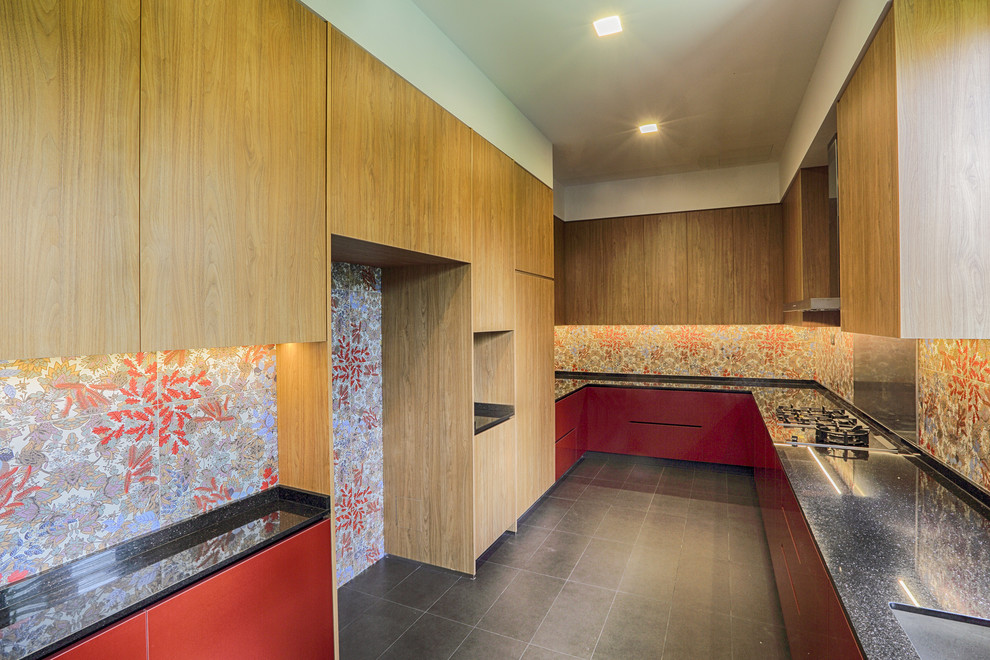 Design ideas for a large modern u-shaped separate kitchen with a double-bowl sink, recessed-panel cabinets, medium wood cabinets, granite benchtops, red splashback, ceramic splashback, panelled appliances, ceramic floors, no island and grey floor.