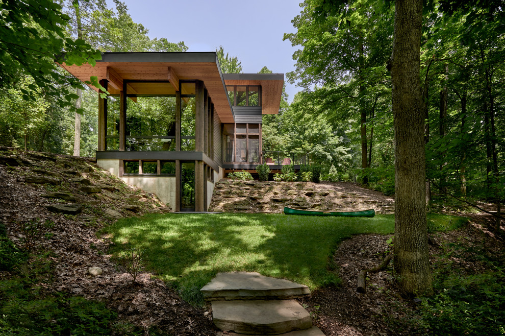 Lawless Retreat - When approached from downslope the arrangement of the house is clearly understood with the master suite atop, screened porch and sundeck below, and the living room in the foreground.