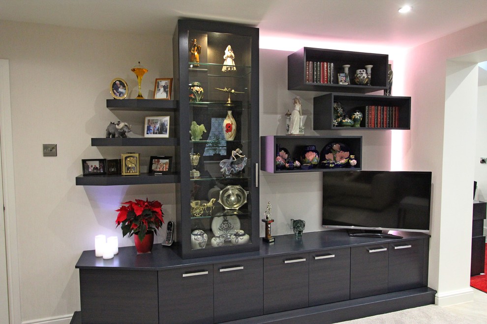 This is an example of a mid-sized contemporary living room in Manchester.