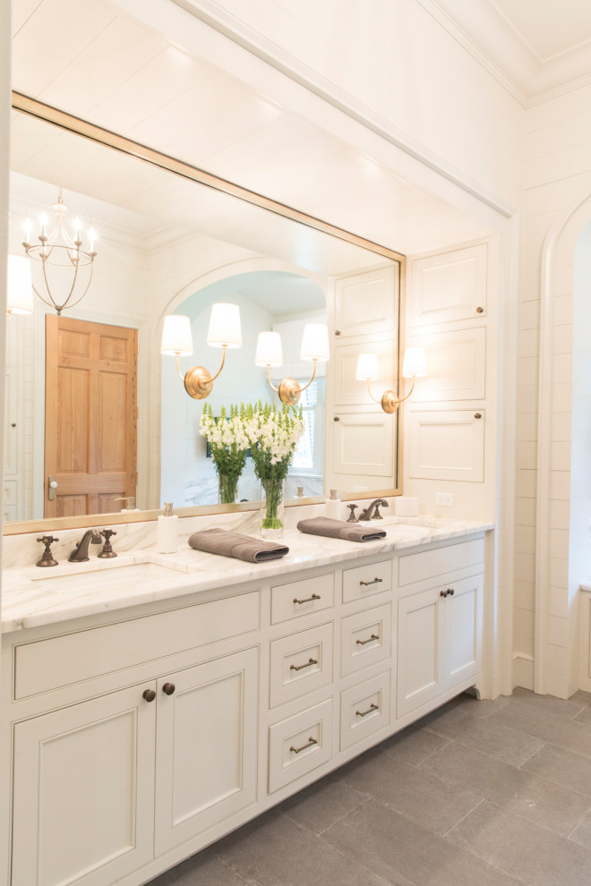 Inspiration for a large traditional master bathroom in New Orleans with recessed-panel cabinets, white cabinets, white walls, porcelain floors, an undermount sink, grey floor, grey benchtops, a double vanity, a built-in vanity, coffered and planked wall panelling.