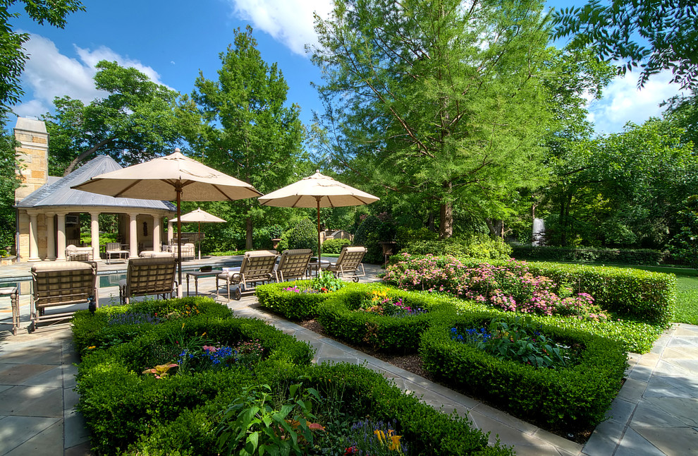 This is an example of a small traditional backyard formal garden in Dallas.