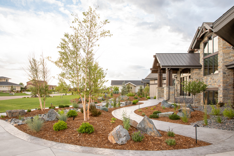 Inspiration for an expansive arts and crafts front yard full sun garden in Denver with with rock feature and mulch.