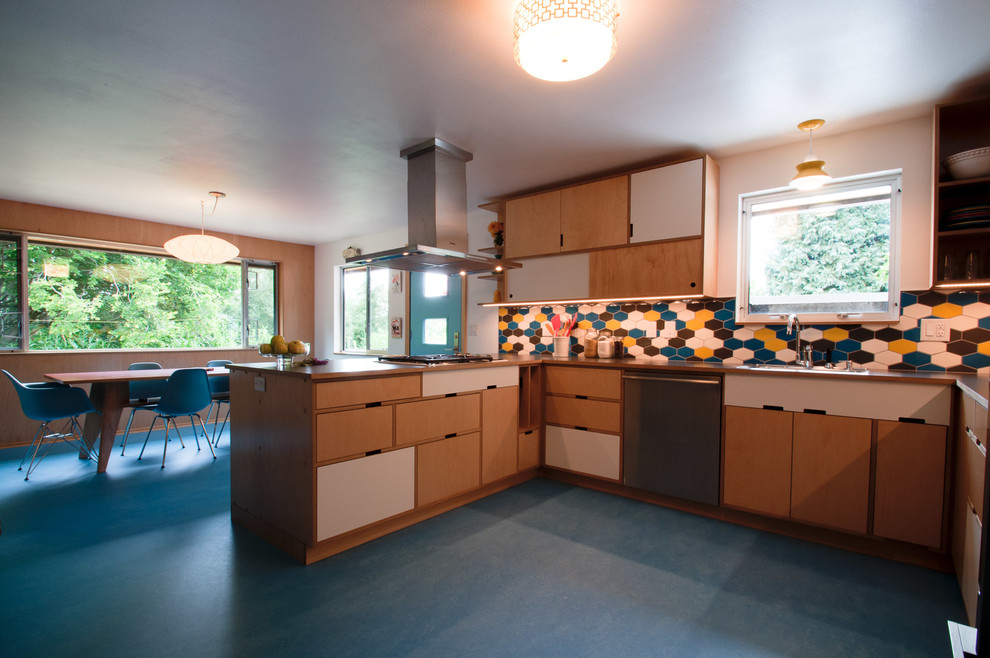 Mid-sized midcentury u-shaped eat-in kitchen in Seattle with flat-panel cabinets, laminate benchtops, multi-coloured splashback, ceramic splashback, stainless steel appliances and linoleum floors.
