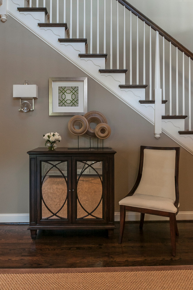 Small transitional dark wood floor foyer photo in Philadelphia with beige walls