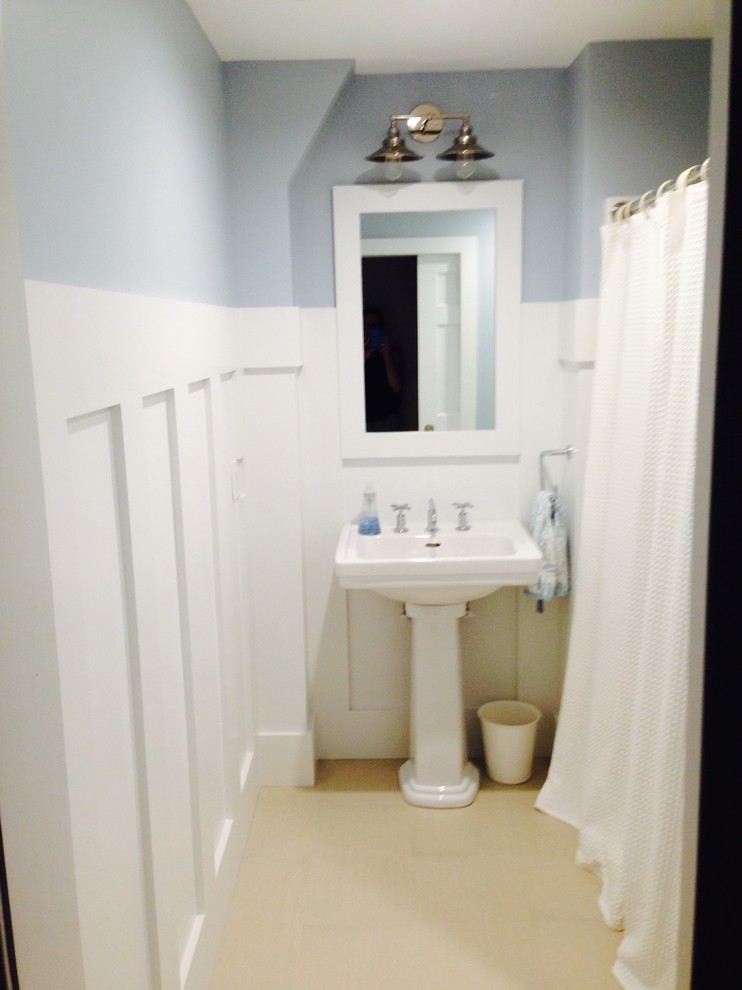 Inspiration for a small traditional bathroom in Boston with an alcove shower, a two-piece toilet, beige tile, ceramic tile, blue walls, ceramic floors and a pedestal sink.