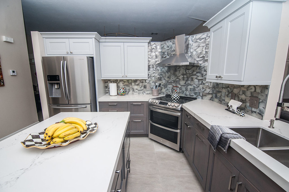 Eat-in kitchen - mid-sized transitional u-shaped porcelain tile and beige floor eat-in kitchen idea in Miami with an undermount sink, shaker cabinets, gray cabinets, quartz countertops, gray backsplash, glass tile backsplash, stainless steel appliances, white countertops and an island