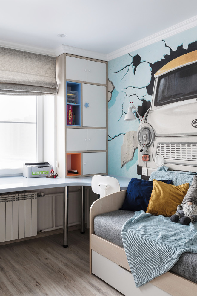 Inspiration for a small contemporary kids' study room for kids 4-10 years old and boys in Saint Petersburg with multi-coloured walls, light hardwood floors and beige floor.