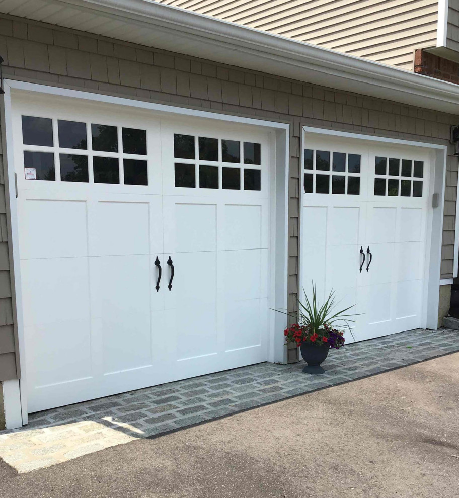 Example of a small classic attached two-car garage design in New York