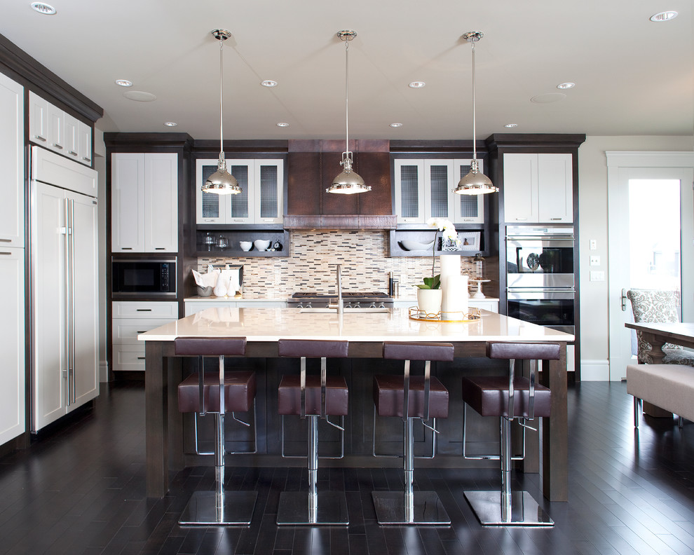 This is an example of a contemporary kitchen in Calgary with panelled appliances.