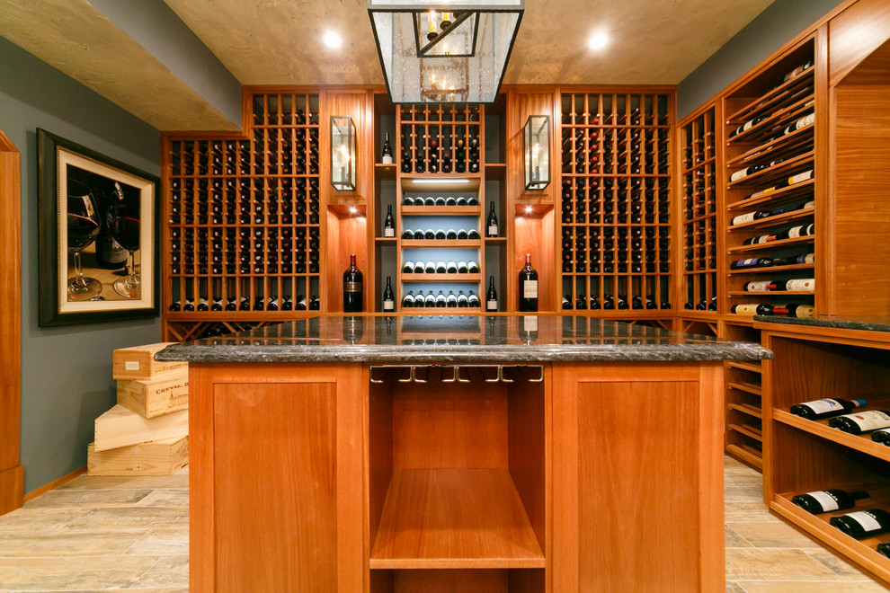 Inspiration for a large traditional wine cellar in New York with porcelain floors and display racks.