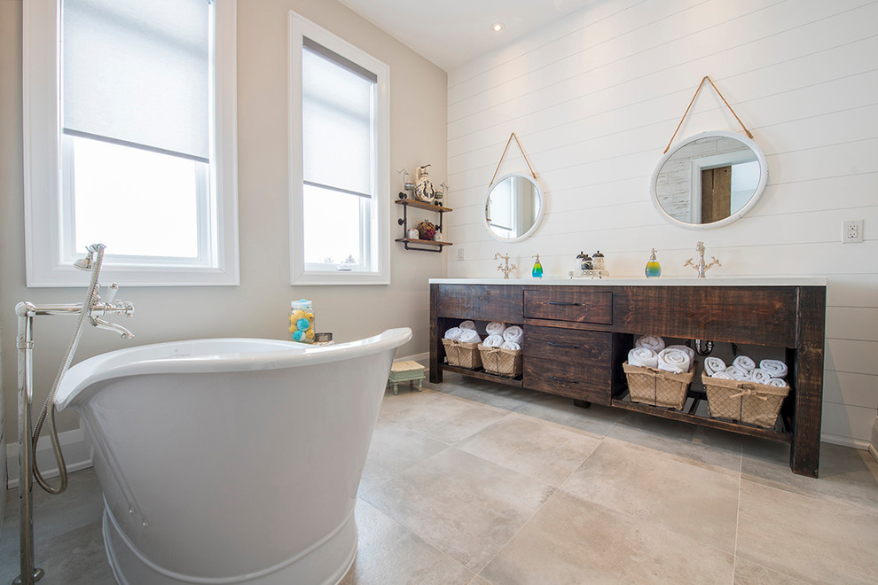 Mid-sized modern master bathroom in Toronto with flat-panel cabinets, white cabinets, a freestanding tub, a corner shower, a one-piece toilet, multi-coloured tile, white walls, an undermount sink, engineered quartz benchtops and a hinged shower door.
