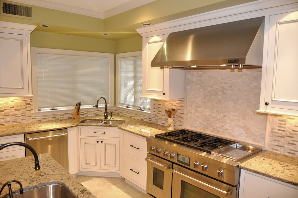 Large traditional u-shaped eat-in kitchen in Other with an undermount sink, beaded inset cabinets, white cabinets, quartzite benchtops, beige splashback, panelled appliances, porcelain floors and with island.