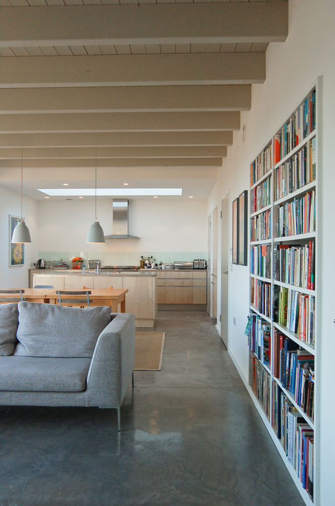 Living room library - mid-sized scandinavian open concept concrete floor living room library idea with white walls