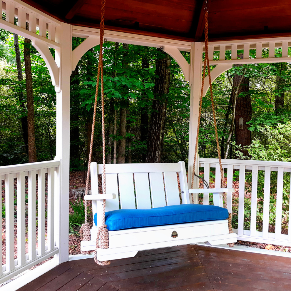 Small classic back wood railing veranda in Atlanta with a pergola.