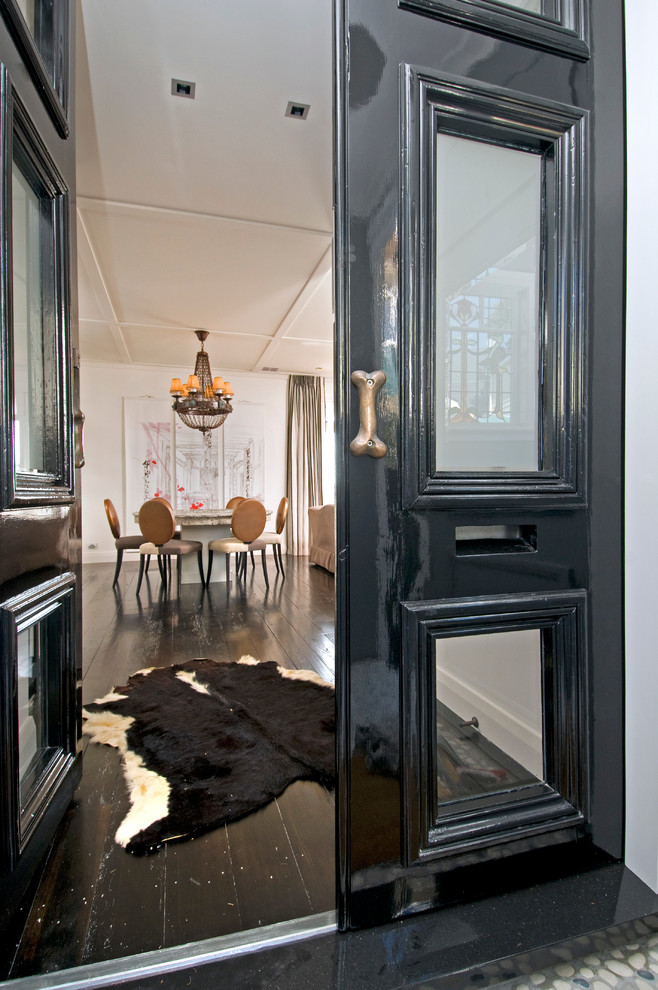 Contemporary entryway in Auckland with white walls, dark hardwood floors, a double front door and a black front door.