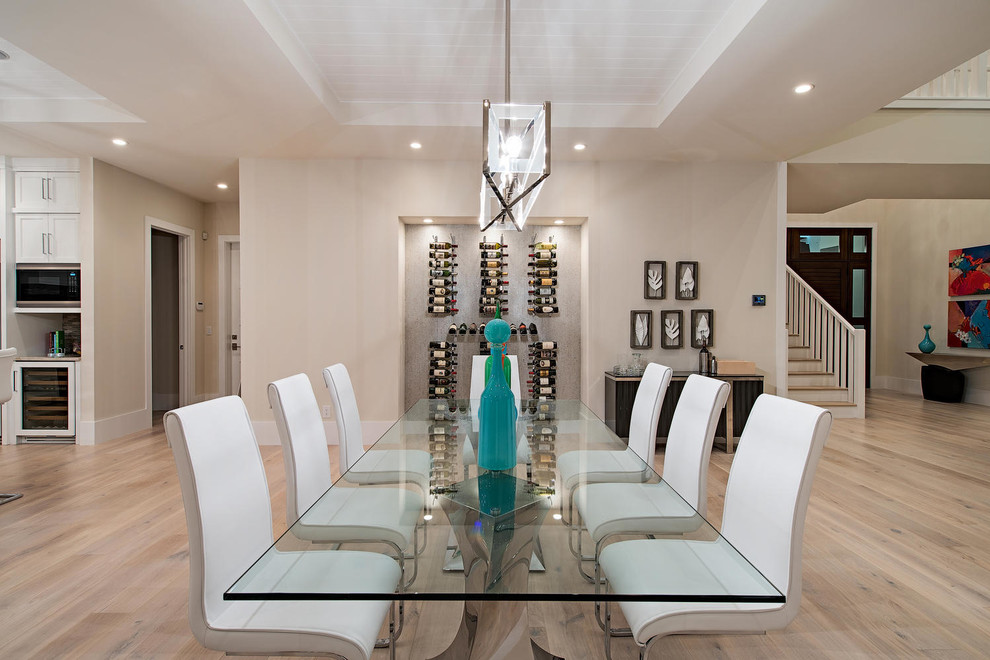 Inspiration for a large transitional dining room in Miami with light hardwood floors.