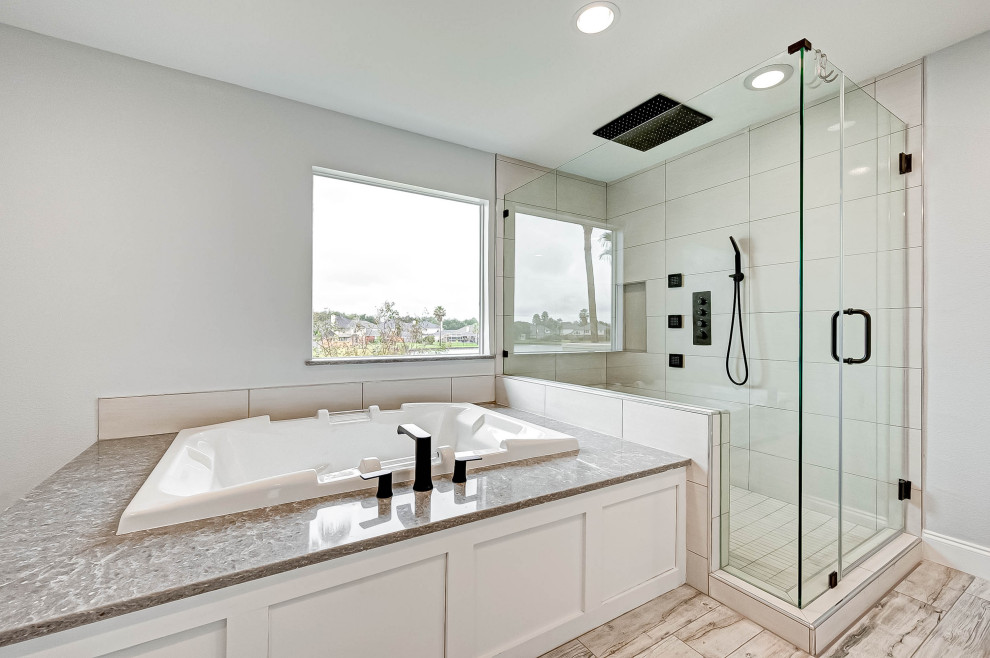 This is an example of a modern master bathroom in Houston with shaker cabinets, white cabinets, quartzite benchtops, a hinged shower door, a shower seat, a double vanity and a built-in vanity.