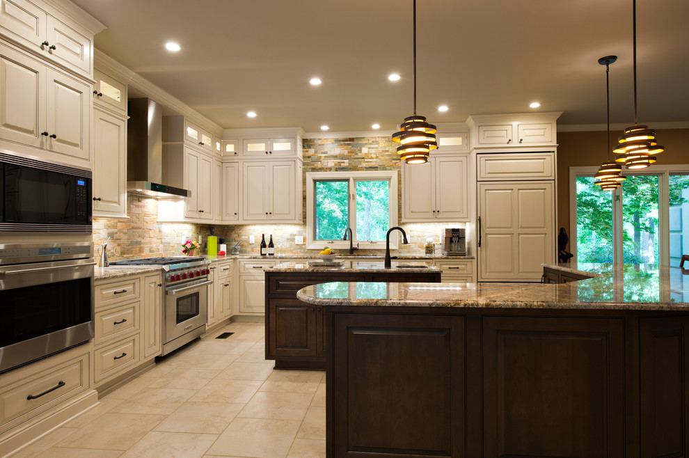This is an example of an expansive transitional l-shaped eat-in kitchen in Little Rock with an undermount sink, raised-panel cabinets, white cabinets, granite benchtops, stone tile splashback, stainless steel appliances, porcelain floors and multiple islands.