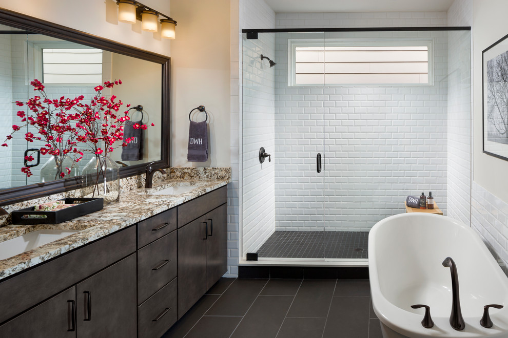 Inspiration for a transitional master bathroom in Atlanta with flat-panel cabinets, brown cabinets, an alcove shower, white tile, subway tile, beige walls, an undermount sink, grey floor, a hinged shower door and multi-coloured benchtops.