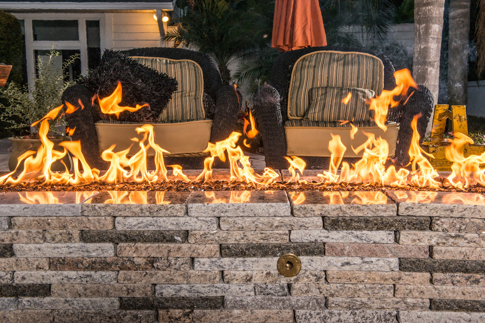 Mid-sized transitional backyard patio in Tampa with a fire feature, tile and no cover.