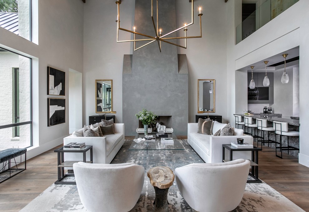 Trendy open concept dark wood floor and brown floor living room photo in Houston with gray walls and a standard fireplace