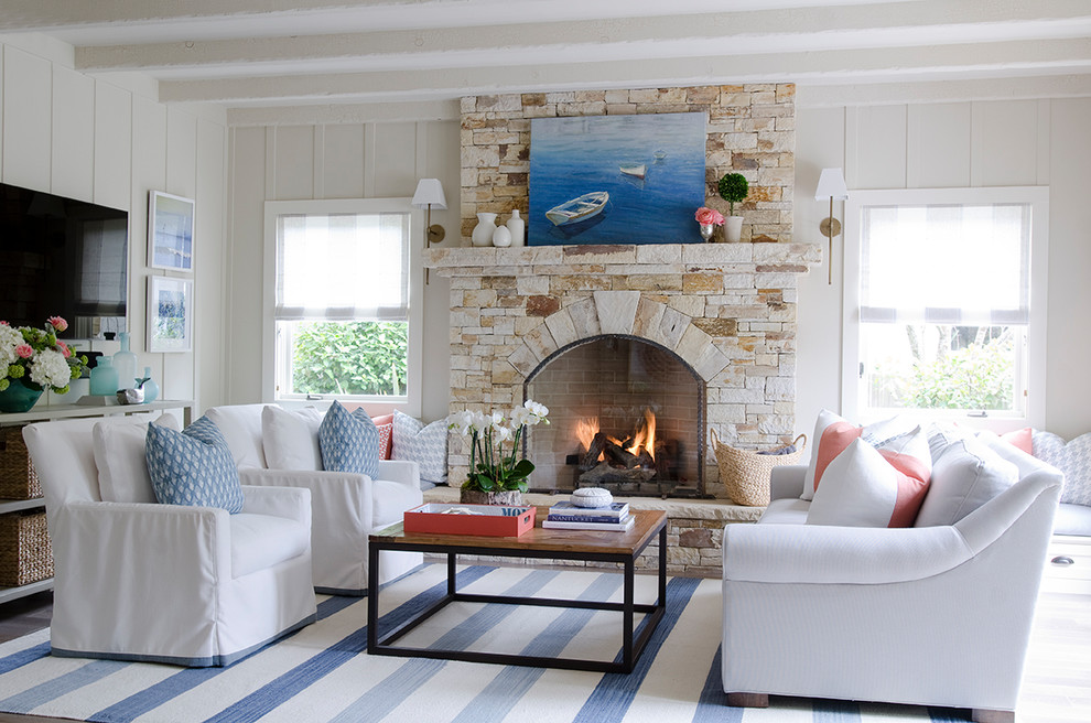 Mid-sized beach style enclosed family room photo in San Francisco with beige walls, a standard fireplace and a stone fireplace