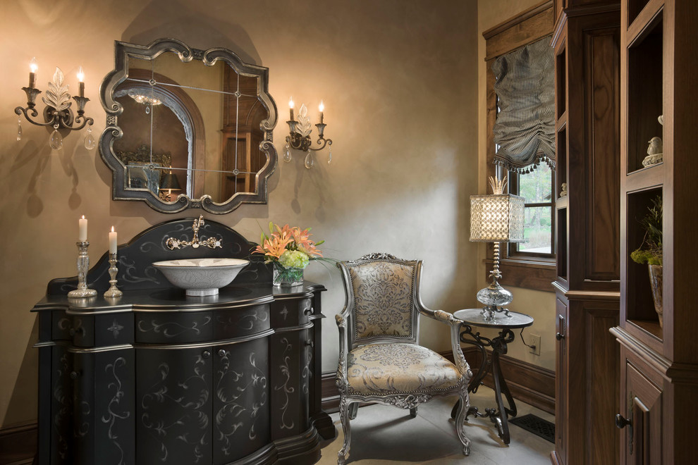 Photo of a mediterranean powder room in Other with a vessel sink.