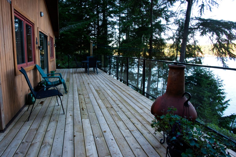 Mid-sized mountain style backyard balcony deck photo with no cover