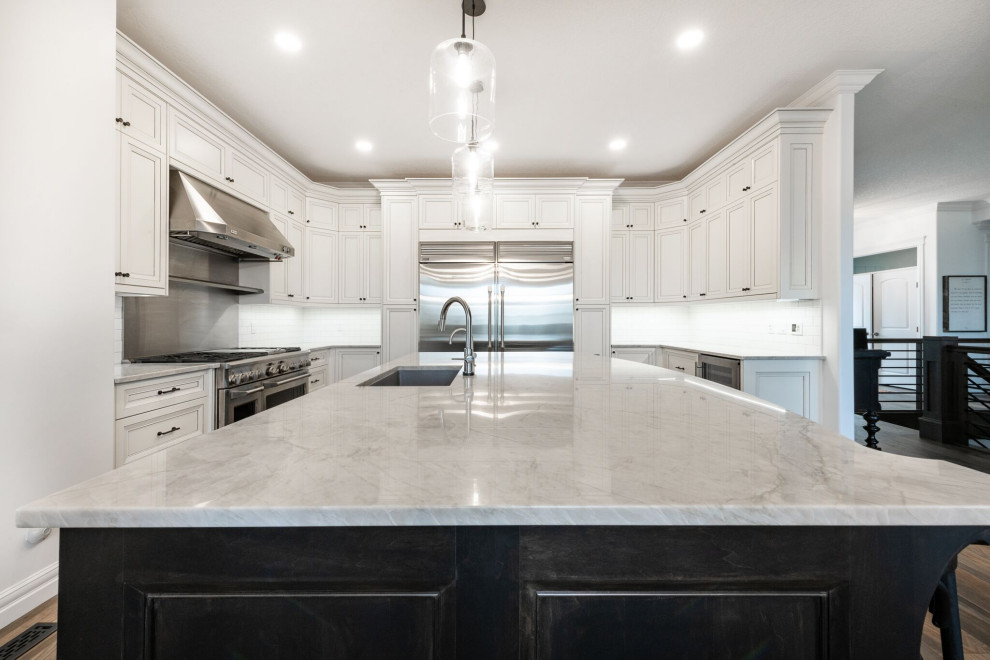Inspiration for a traditional kitchen in Edmonton with white cabinets, granite benchtops, stainless steel appliances, with island and white benchtop.