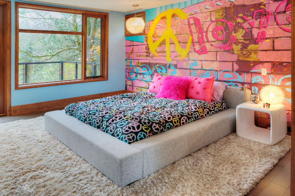 This is an example of an eclectic kids' room for girls in Toronto with multi-coloured walls.