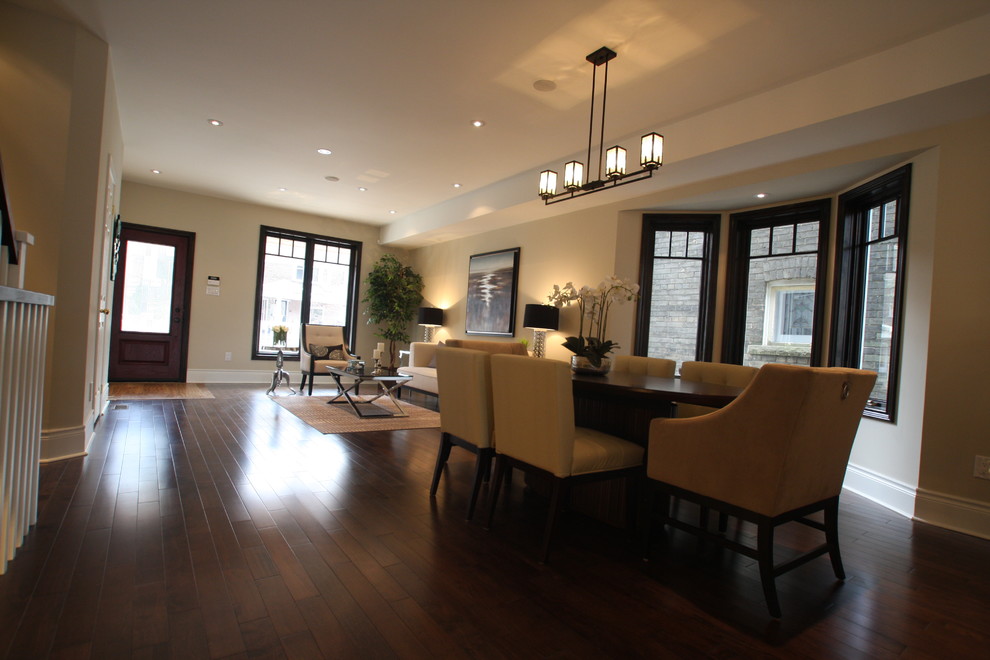 Design ideas for a mid-sized transitional open plan dining in Toronto with beige walls, dark hardwood floors and no fireplace.