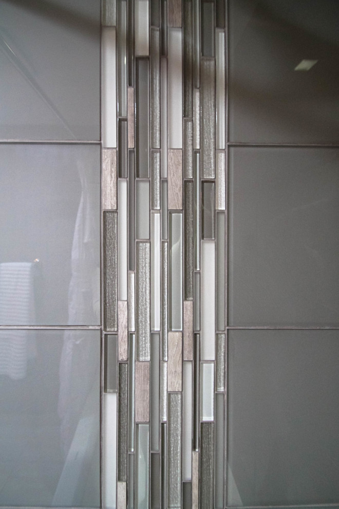 Mid-sized transitional gray tile and glass tile porcelain tile home design photo in Denver with shaker cabinets, gray cabinets, a one-piece toilet, gray walls, an undermount sink and marble countertops
