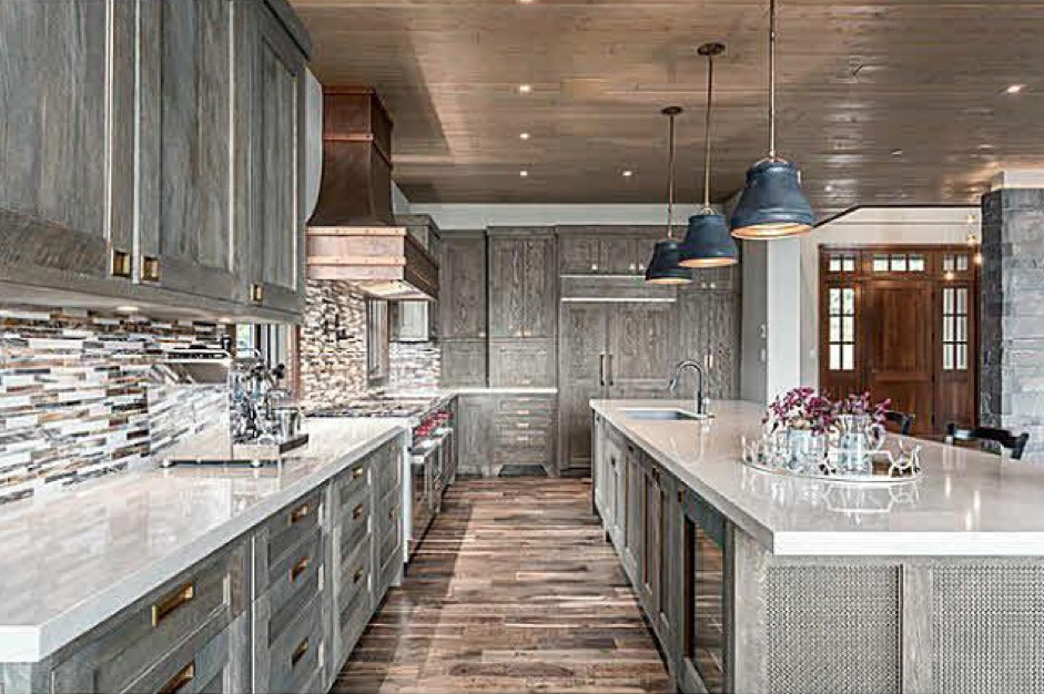 Open concept kitchen - large transitional l-shaped dark wood floor and brown floor open concept kitchen idea in Vancouver with an undermount sink, shaker cabinets, gray cabinets, multicolored backsplash, matchstick tile backsplash, an island and paneled appliances