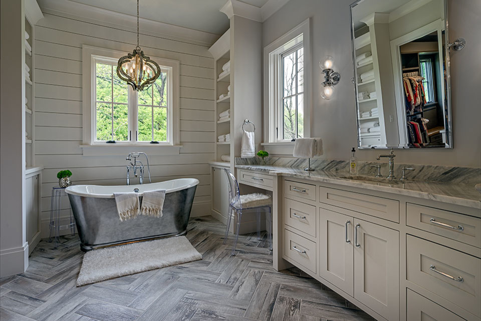 Design ideas for a large country master bathroom in Nashville with beaded inset cabinets, white cabinets, a freestanding tub, a corner shower, gray tile, marble, grey walls, porcelain floors, an undermount sink, engineered quartz benchtops, grey floor and a hinged shower door.