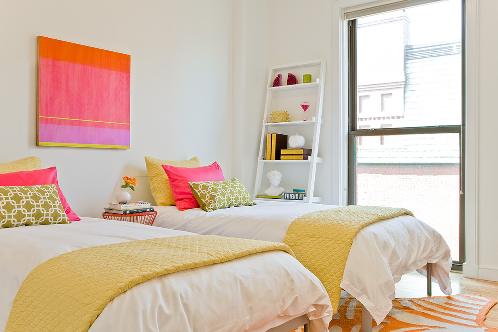 This is an example of a mid-sized contemporary kids' bedroom for kids 4-10 years old and girls in Boston with white walls and light hardwood floors.